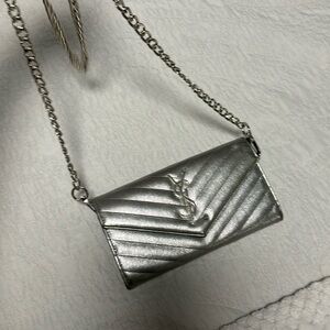 Silver YSL cassandre wallet on chain
